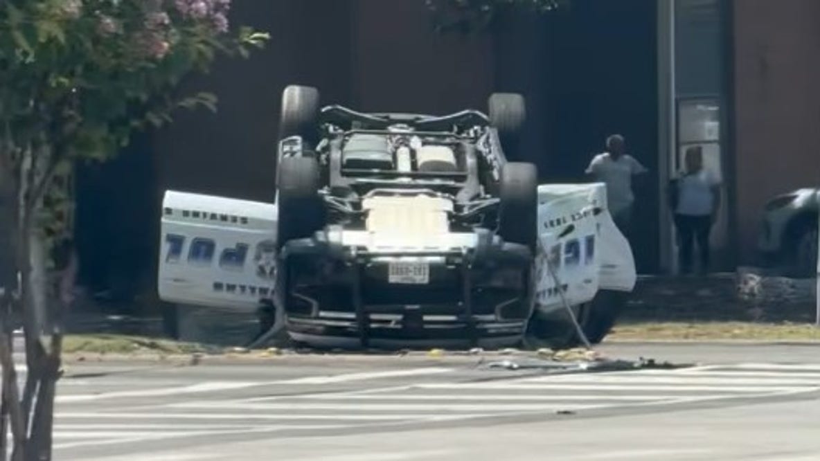 Dallas police officer, driver hospitalized after patrol car flips in crash