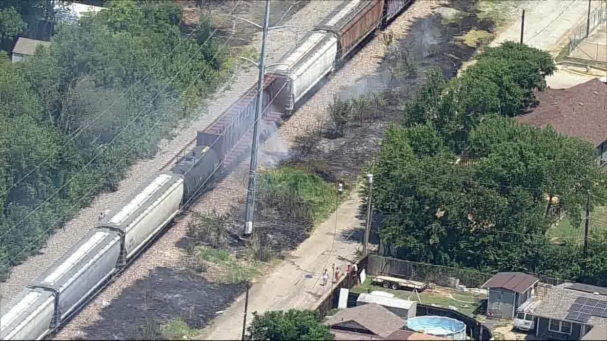 Fire burns along train tracks in Fort Worth
