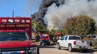 4-alarm Dallas grass fire spreads to home, tires sending thick smoke into air