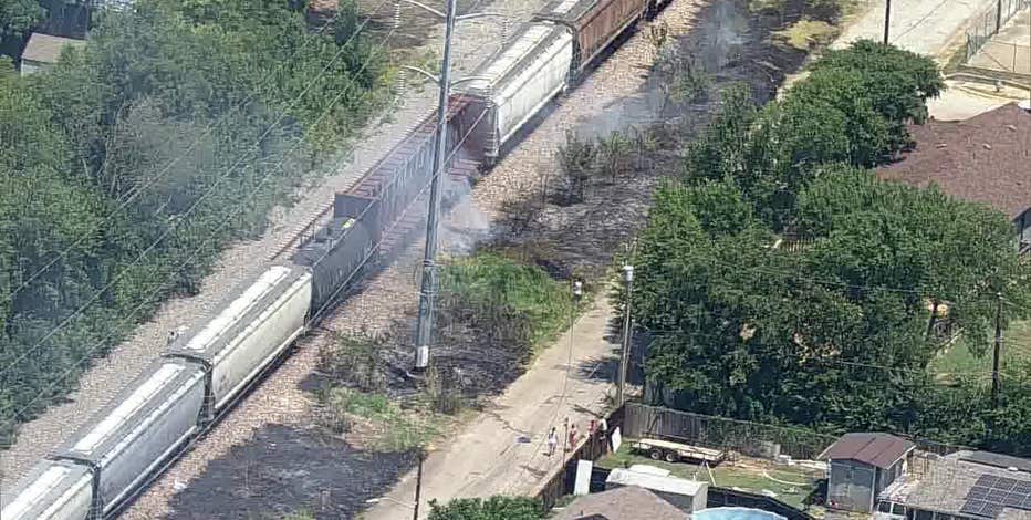 Fire burns along train tracks in Fort Worth