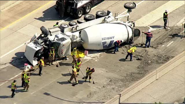 Overturned concrete truck closes southbound DNT