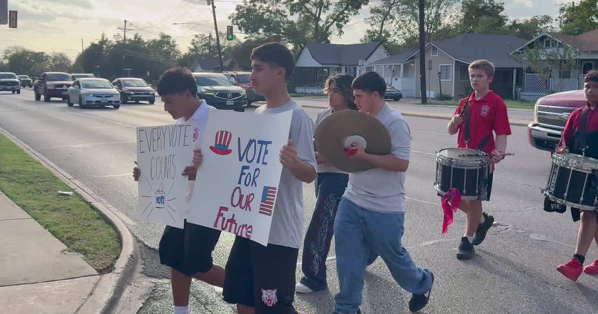 Dallas high school students march to the polls for early voting