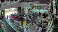 Watch: Car crashes into Carrollton smoke shop, driver was trapped