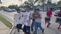 Dallas high school students march to the polls for early voting