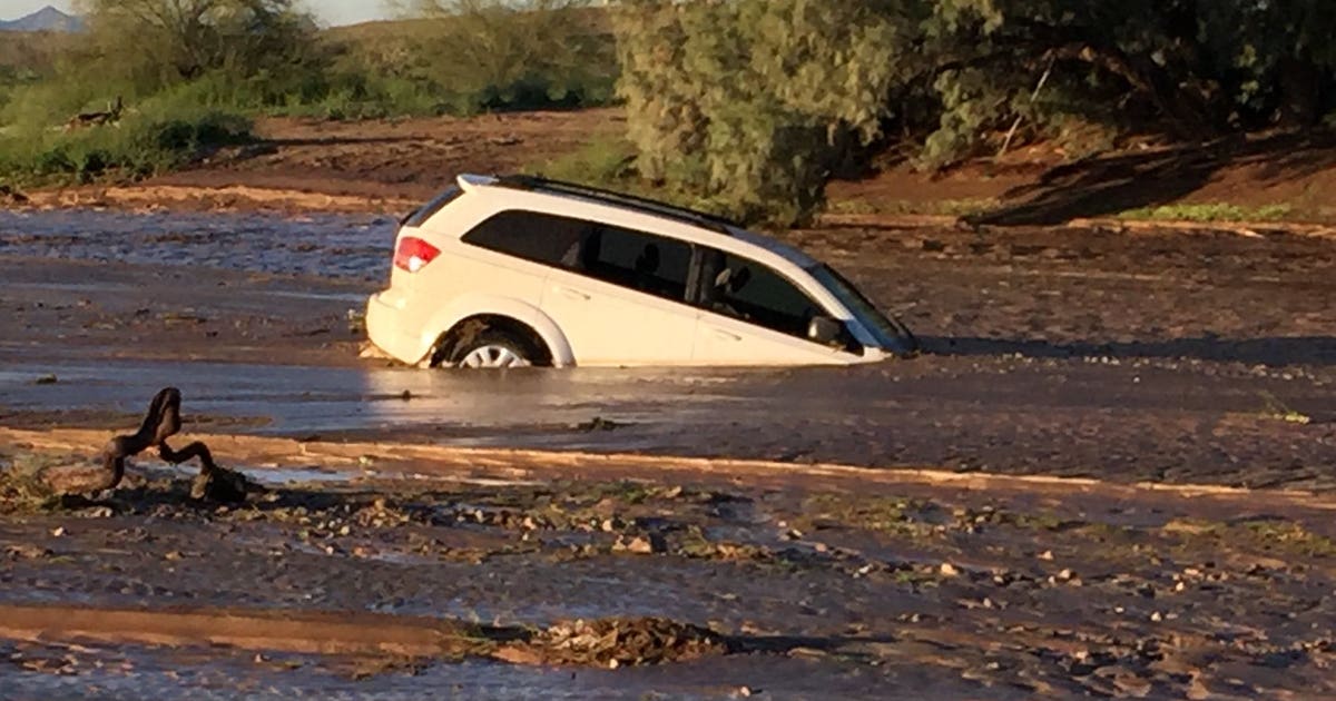 Tonopah, Phoenix firefighters rescue man trapped in flooded minivan ...