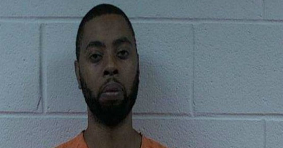 Man arrested after police find more than 100 dogs chained to trees ...