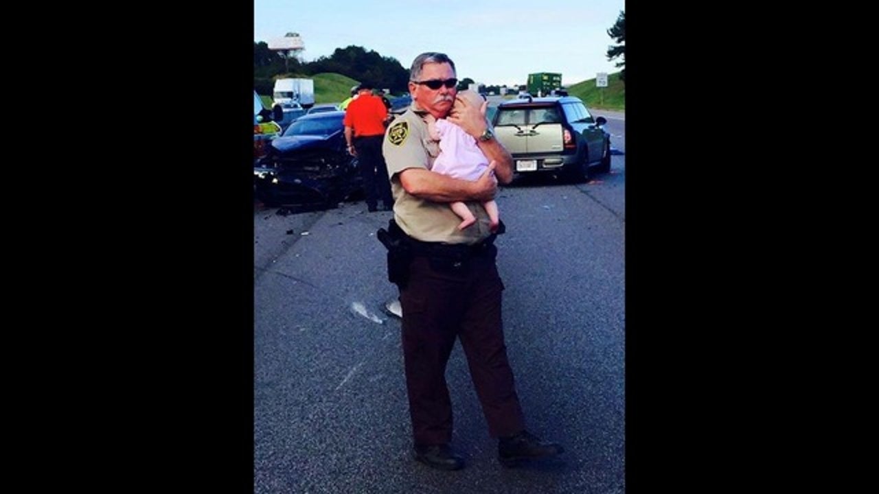 Deputy Spotted Comforting Child Following Interstate Crash | FOX 5 Atlanta