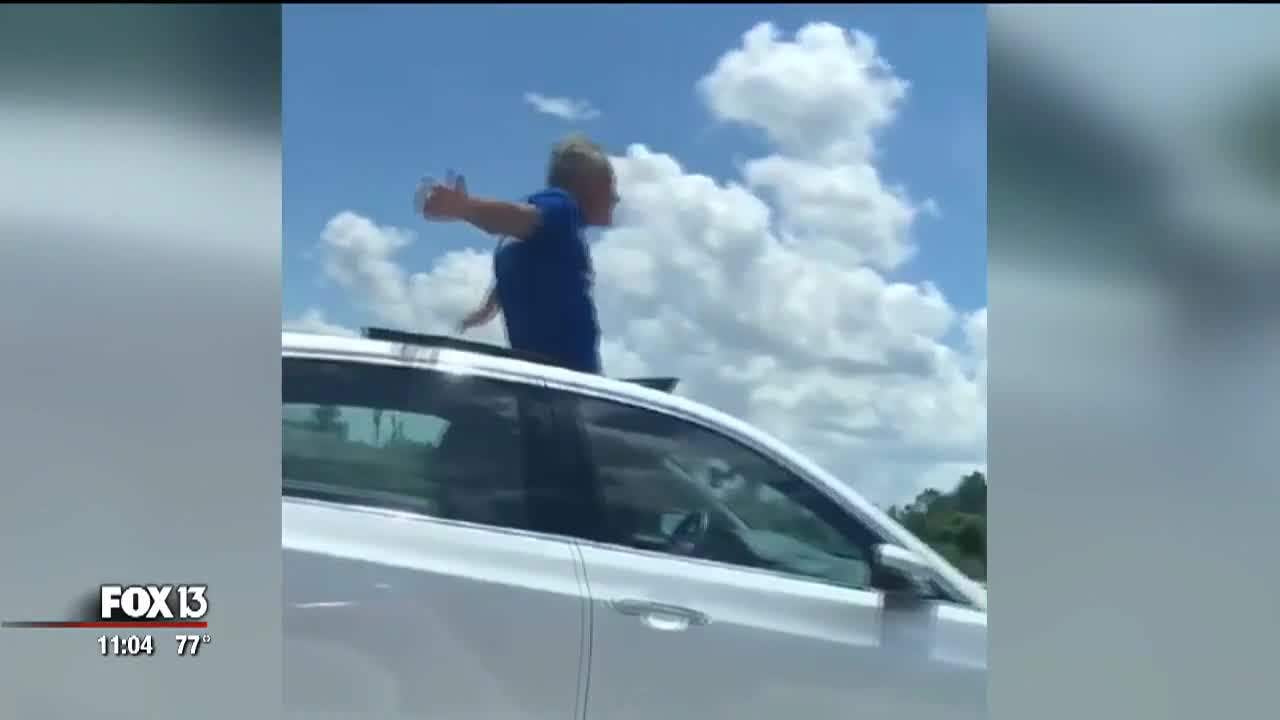 Offduty deputy records Florida man standing in sunroof while traveling