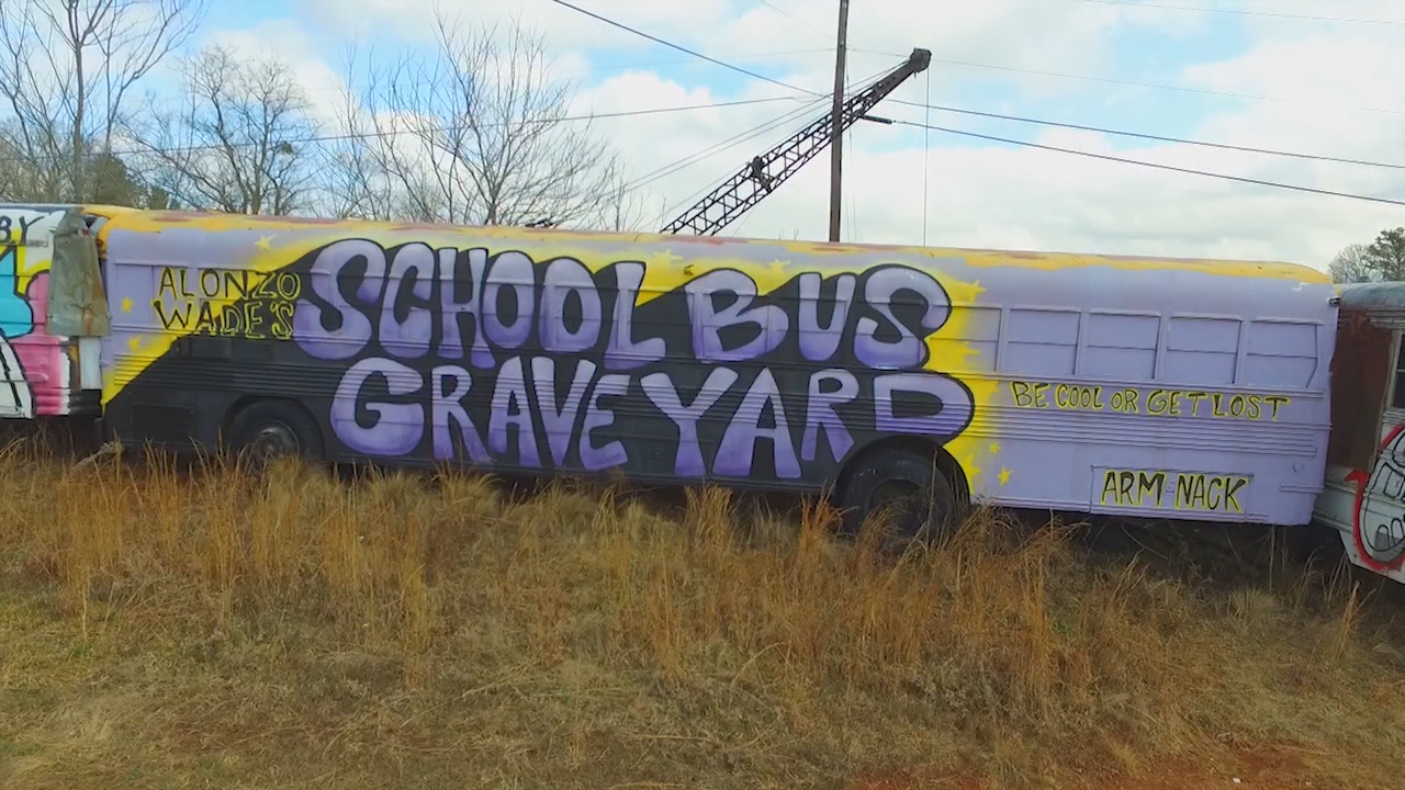 Artists use old buses as a canvas at the School Bus Graveyard