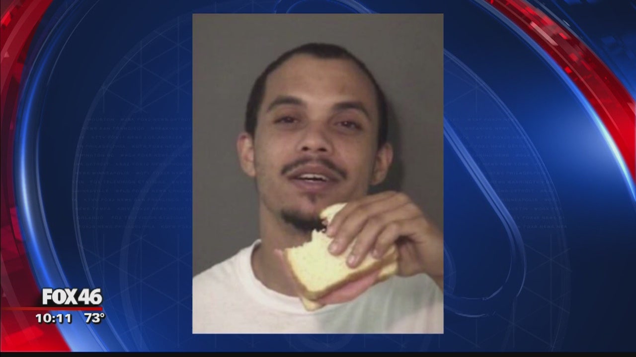 Union County inmate snacks on sandwich in mugshot