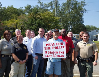 P BUTTS POLICE SUPPORT SIGN 11P_WAGA85ef_146.mxf_00.01.04.09_1442372165908.png