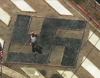Man_says_swastika_lawn_display_is__Tibet_0_20190605020411-405538