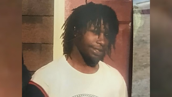 Police: Man standing in front yard gunned down