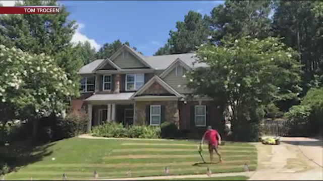 Cobb County man mows American flag into lawn