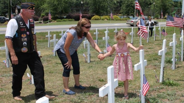 Hiram honors the fallen after restoring crosses