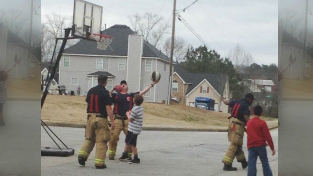 Henry County firefighters shoot hoops with local kids