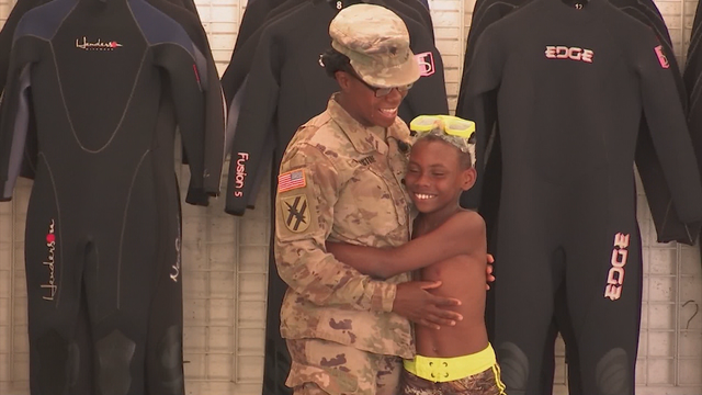 Military mother surprise son during scuba class