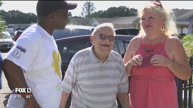 Hillsborough firefighters paint WWII veteran's home