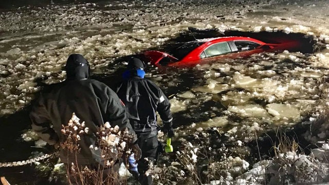 Driver rescued from icy Massachusetts pond