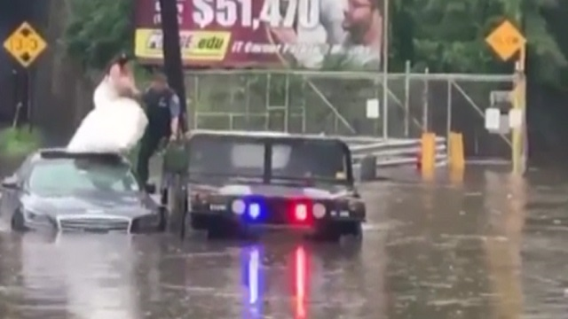 NJ police rescue bride and groom from flooded car on wedding day