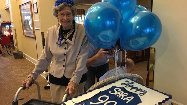 Walton High School students help celebrate a special lady