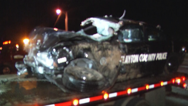 Clayton County Police officer pulled from car after crash