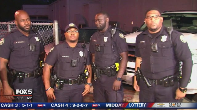 VIDEO: Atlanta Police officers save two people from burning car
