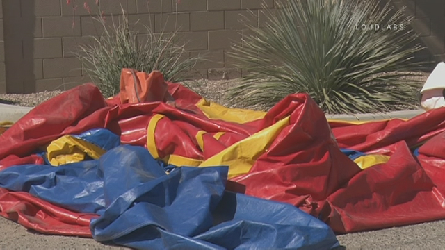 Bounce house flies away with kid inside