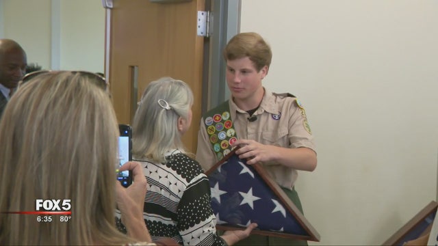 Boy Scout gives memorial flag cases to veterans' families