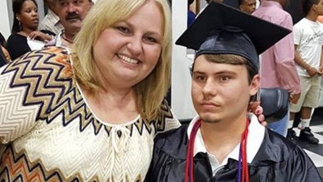 Teen with Muscular Dystrophy walks across stage on graduation day