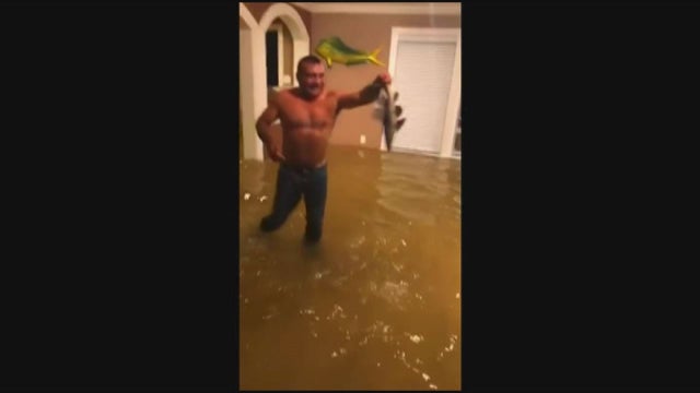 WATCH: Man catches fish in living room