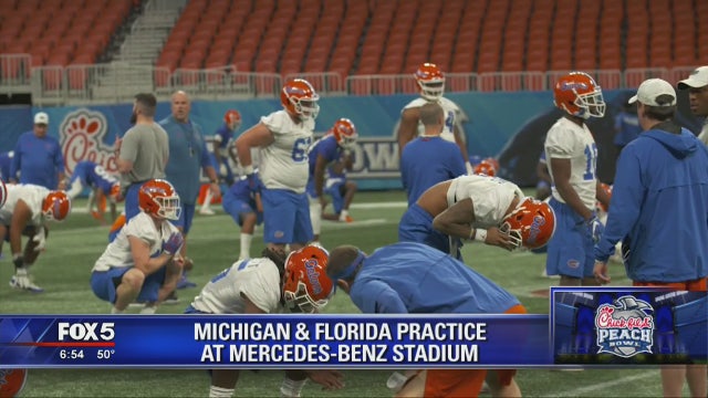 Michigan adjusts to decisions by 4 to skip Peach Bowl