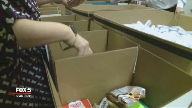 Volunteers pack 'hero boxes' for deployed service members