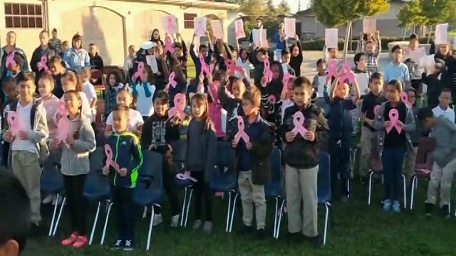 Elementary school students sing 'Lean on Me' to principal fighting cancer