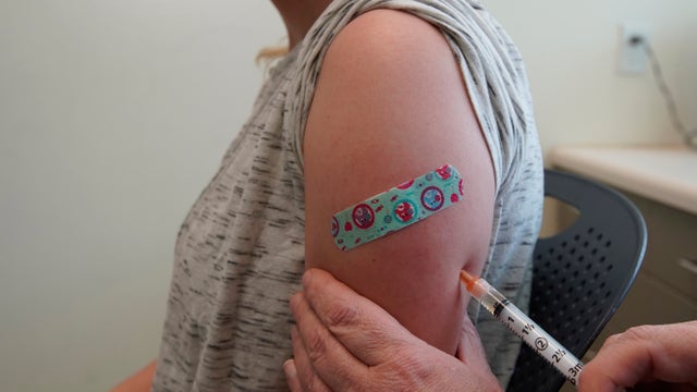 As measles cases climb, some Americans might need another shot