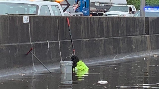 GDOT worker 'risks life' to clear drain on interstate