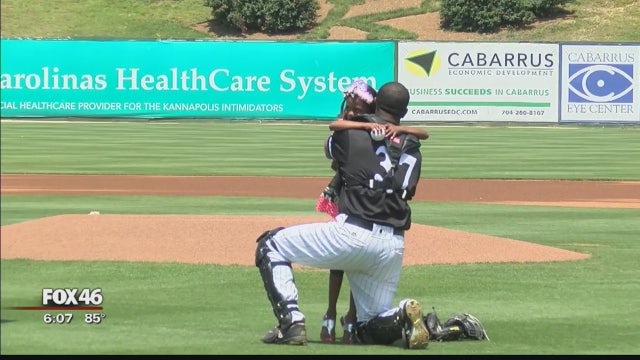 Military father surprises daughter at local baseball game