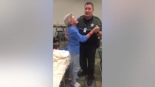 Deputy dances with woman to calm her nerves about Irma