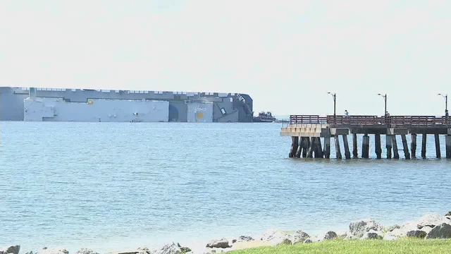 Salvage experts to haul overturned cargo ship away in pieces