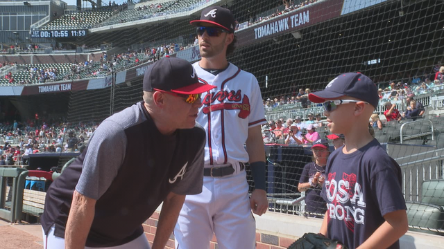 Young cancer survivor throw out Braves' first pitch
