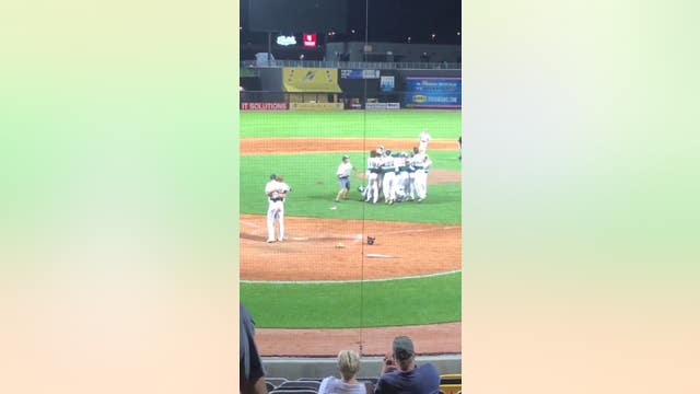 Pitcher embraces batter after game-ending strikeout in Minnesota high school playoffs