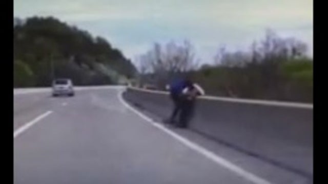 VIDEO: Police tackle man trying to jump off bridge