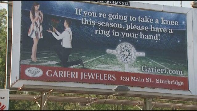 Massachusetts jewelry store under fire for 'take a knee' billboard