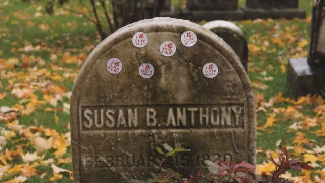 Susan B. Anthony's grave decorated with 'I Voted' stickers