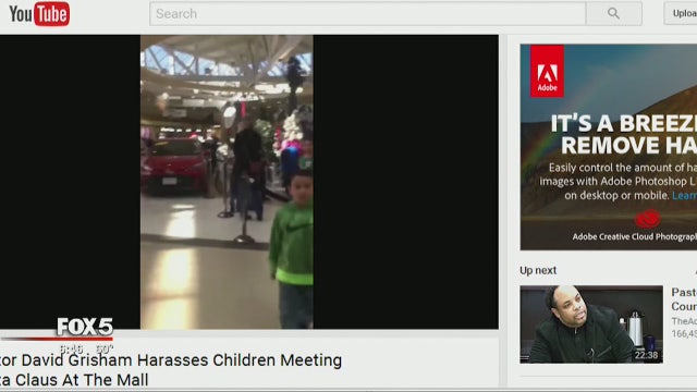 Video: 'Street preacher' yells at parents with children waiting for Santa