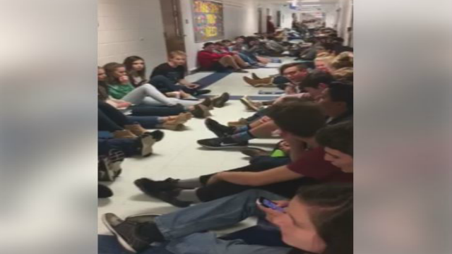 High School students sing to keep calm during storm warning