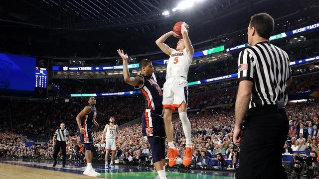 Guy hits free throws on disputed foul, Virginia shocks Auburn 63-62