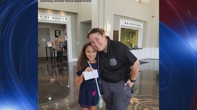 Duluth Police officer returns lost envelope of cash to rightful owner