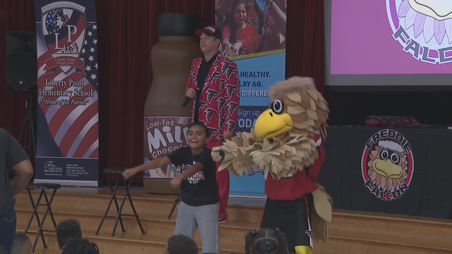 Falcons surprise school with grant