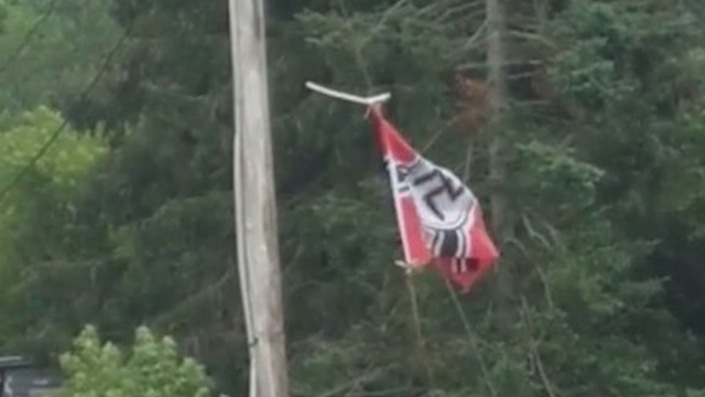 Man refuses to take down Nazi flag